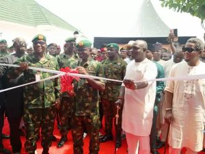 The General Officer Commanding (GOC), 6 Division, Nigerian Army, Major General Emmanuel Ejim-Emekah, flanked by the Managing Director of Tantita Security Services Nigeria Limited, High Chief Kestin Pondi, and other dignitaries during the cutting of the tape at Sector 1