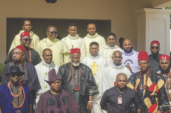 • Igwe Alison with Catholic Priests and freinds after the Holy Mass during the ceremony