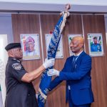 Acting IGP Tunji Disu (L) and outgoing IGP Kayode Egbetokun (R)
