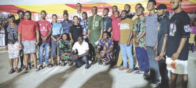 Chief Nwosu (centre in green) flanked on both sides by his outstanding workers who received awards