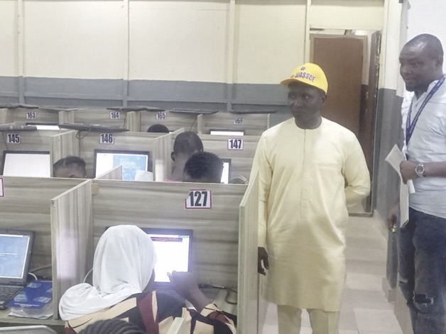 Dangut (left) with Mount Gilgal CBT official during monitoring of exam