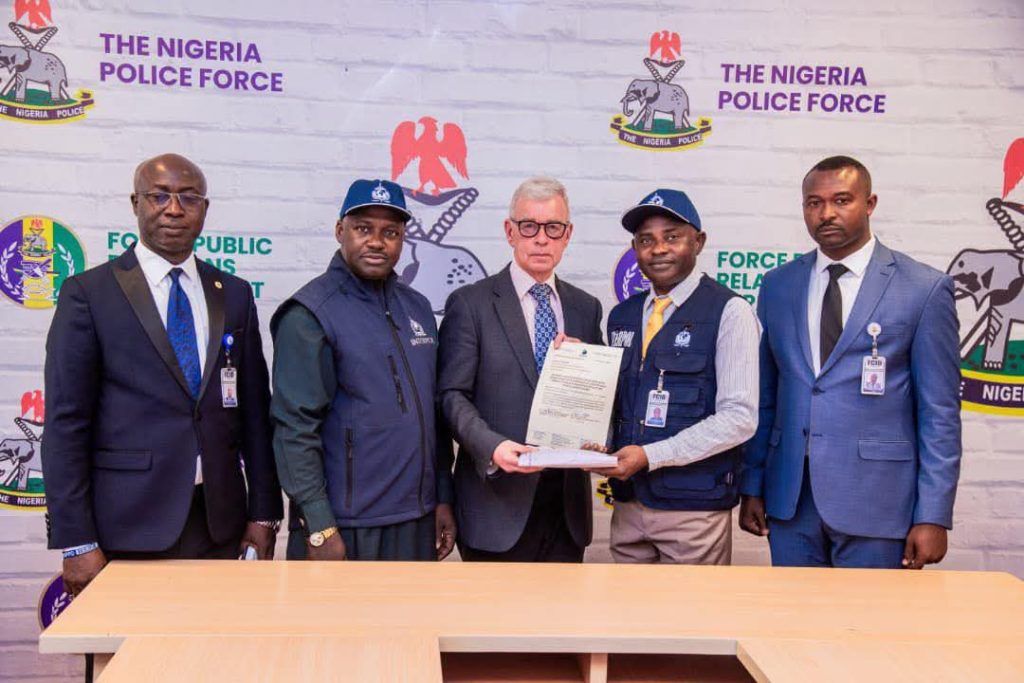 Nigeria police return $23,000 recovered from fraudster to Cayman Islands victim