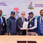 Nigeria police return $23,000 recovered from fraudster to Cayman Islands victim