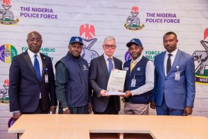 Nigeria police return $23,000 recovered from fraudster to Cayman Islands victim