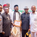 Chief Ezeobi (middle) with Igbo entrepreneurs after receiving The Sun Award in Lagos.
