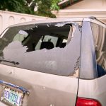 One of the shattered vehicles at Chief Oyegun’s compound