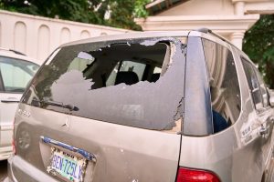 One of the shattered vehicles at Chief Oyegun’s compound