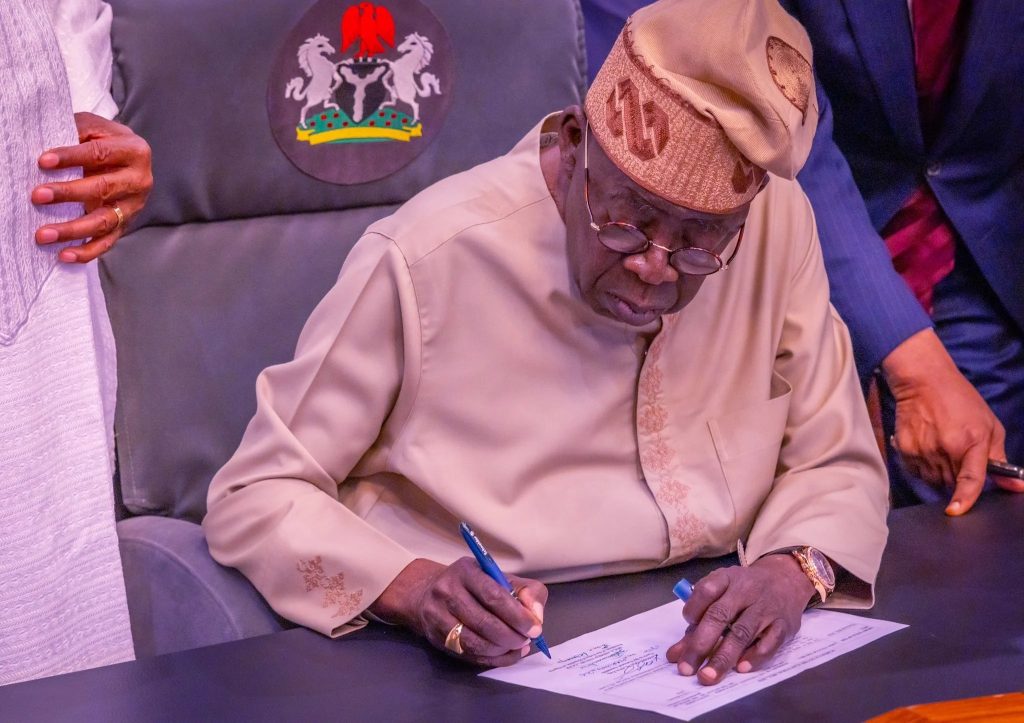 President Bola Tinubu signing the Electoral Act 2026 (Amendment) into law at the Presidential Villa, Abuja on Wednesday. Photo- X:@DOlusegun