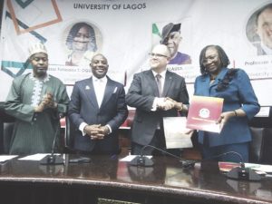 R-L- Ogunsola and William exchange MoU, while Alausa and Ribadu watch