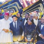 Senate President Godswill Akpabio with the celebrant, wife and guests