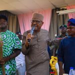 L-R: APC chairmanship candidate for Bwari Area Council, Joshua Musa, Minister of FCT Nyesom Wike (m), Julius Adamu, PDP chairmanship candidate after the later stepped down for Musa
