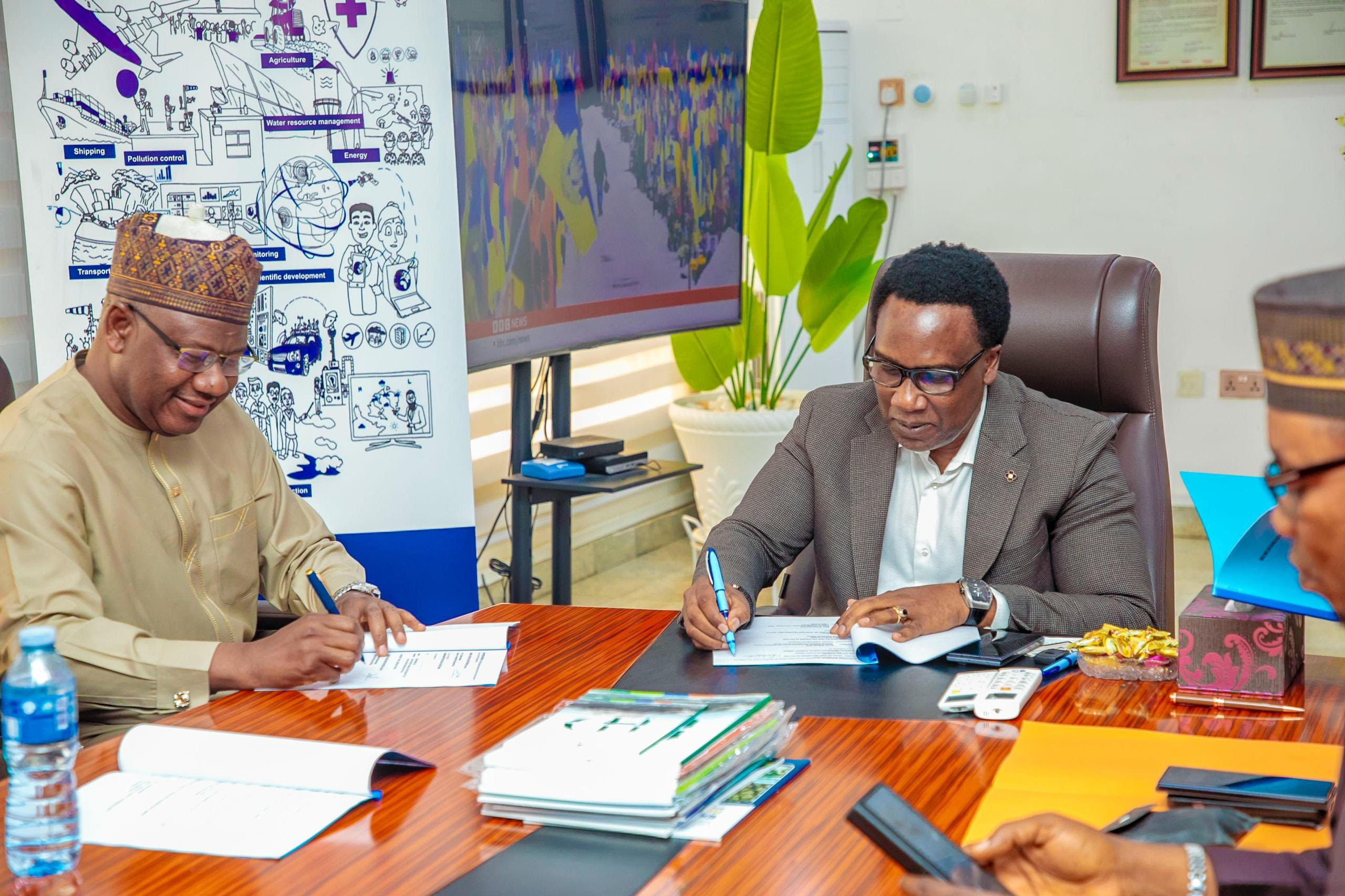 Prof Charles Anosike DG/CEO NiMet (R) and Dr. Danjuma Ismaila Rector NCAT (L)