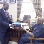 Elom handing over the mantle of leadership to Nwachukwu