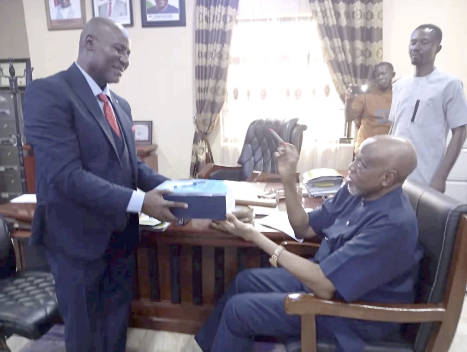 Elom handing over the mantle of leadership to Nwachukwu