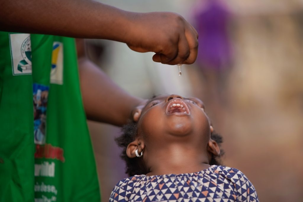girls receiving vaccine shot