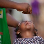 girls receiving vaccine shot