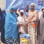 Hajia Idris and NEMA Director General, Hajia Zubaida Umar, distributing relief items to vulnerable people in Birnin Kebbi