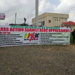 The protesters parading their banner at the Museum ground at the Ring Road, Benin City, Monday, March 2, 2026
