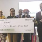 L-R- Ahmad, Alausa (middle), Attafuah and Tijani displaying cheque to one of the winners