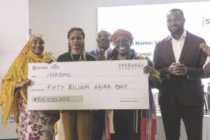 L-R- Ahmad, Alausa (middle), Attafuah and Tijani displaying cheque to one of the winners