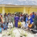 Nweze with residents