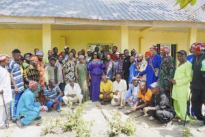 Nweze with residents