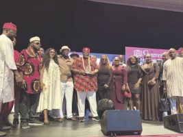 Nzekwesi, flanked by family and friends after receiving the award in Lagos