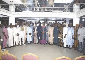 Okwelle (middle) with stakeholders at workshop