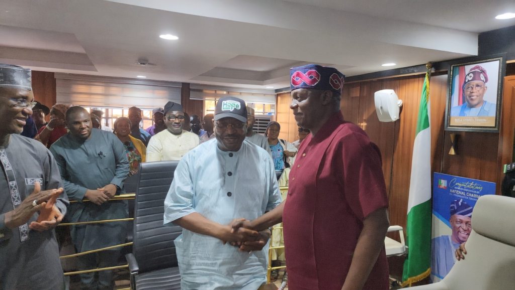 Senator Philip Tanimu Aduda (centre) being welcomed into the APC party