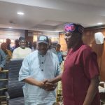Senator Philip Tanimu Aduda (centre) being welcomed into the APC party