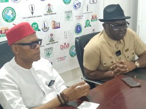 Dr. Festus Alenkhe, chairman, NUJ, Edo State council (l) and Washington Osifo (r) during a press briefing in Benin City