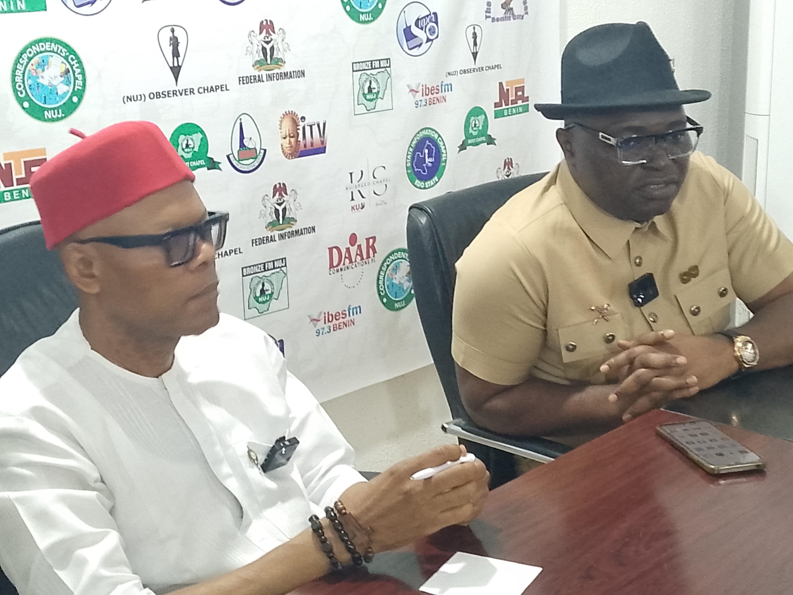 Dr. Festus Alenkhe, chairman, NUJ, Edo State council (l) and Washington Osifo (r) during a press briefing in Benin City