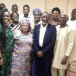 Abdul (middle) with college officers at the event