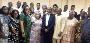 Abdul (middle) with college officers at the event