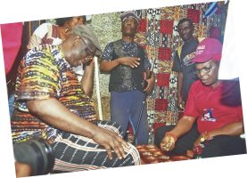 Ekiti Deputy Governor, Princess Monisade Christiana Afuye and Senator Babafemi Ojudu in a traditional game of Ayo Olopon inside Ugele cave