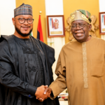 Governor Lawal and President Tinubu shake hands