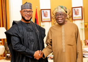 Governor Lawal and President Tinubu shake hands