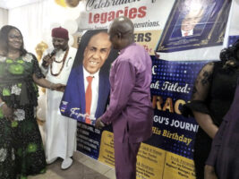 Presentation of a portrait to Mbisiogu and wife