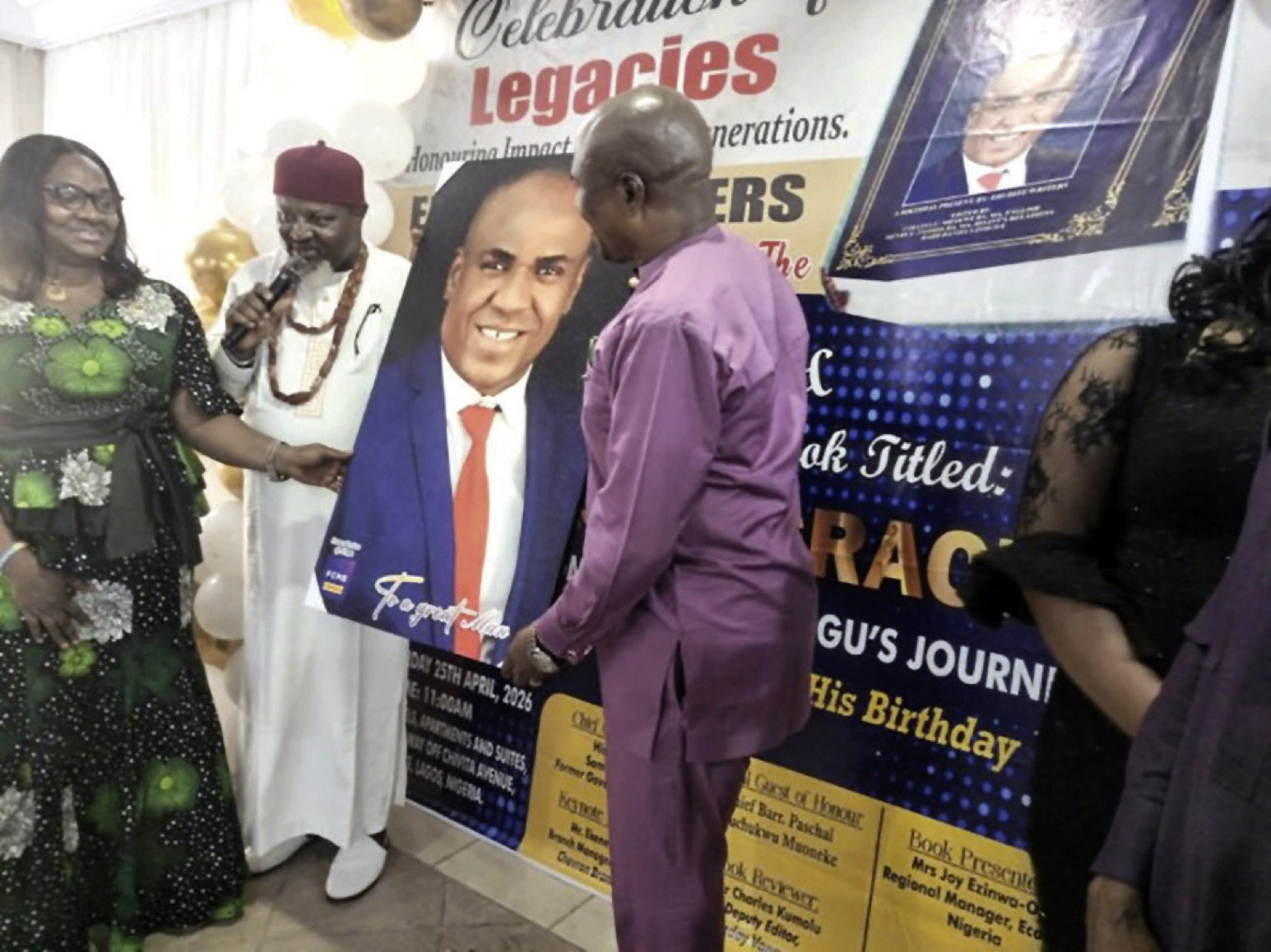 Presentation of a portrait to Mbisiogu and wife