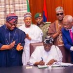 Tinubu_signing_budget-696×392