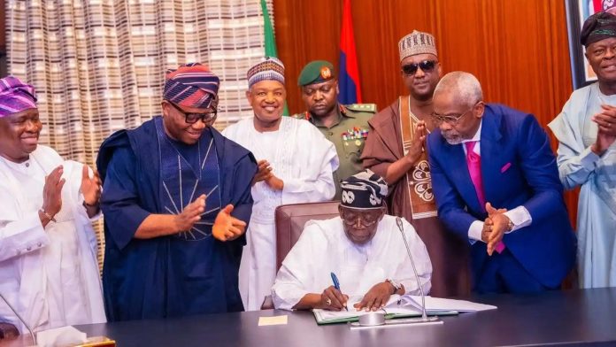 Tinubu_signing_budget-696×392