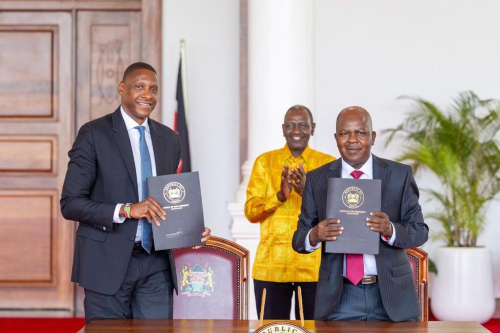 Masai Ujiri (L) displays landmark arena deal with Kenya Railways