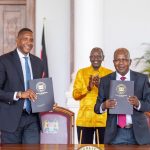 Masai Ujiri (L) displays landmark arena deal with Kenya Railways