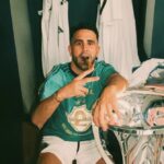 Riyad Mahrez poses with the ADC Champions League title