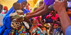 A health worker screening children for malnutrition at Gwange PHCC Dama