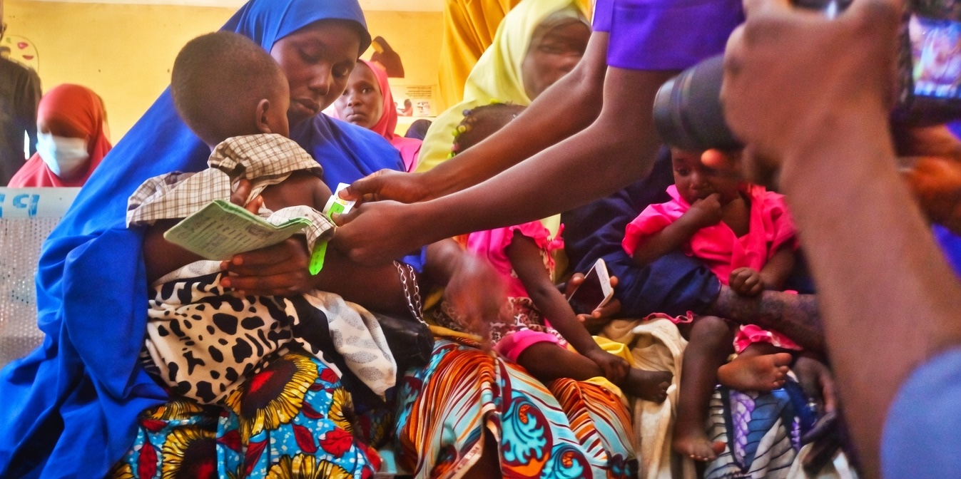 A health worker screening children for malnutrition at Gwange PHCC Dama