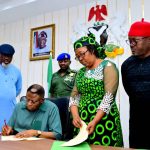 Gov. Otu assenting to the new laws in the presence of the Speaker of the State Assembly Elvert Ayambem, the Chief of Staff Emmanuel Ironbar and others