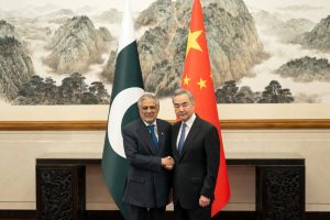 Chinese Foreign Minister Wang Yi (right) with Pakistani Deputy Prime Minister and Foreign Minister Mohammad Ishaq Dar in Beijing (Photo credit: Xinhua News Agency)
