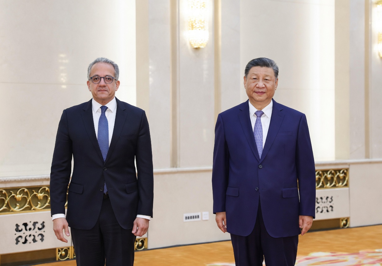 Chinese President Xi Jinping (r), with the Director General of the United Nations Educational, Scientific and Cultural Organization (UNESCO), Khaled El-Enany, at the Great Hall of the People in Beijing