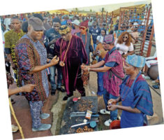 Akinboboye (left) and other guests moving round to taste the Asun delicacy